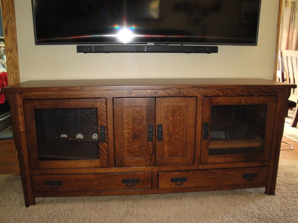 Mounting her TV on the wall lets Peggy use her TV stand to store more electronics and decorate with its beautiful woodgrain.