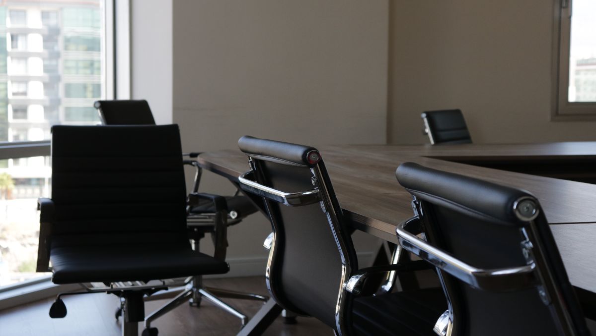 A line of office chairs inside the conference room.