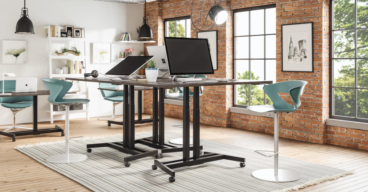 an office with two standing desks in the middle