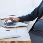 Pregnant woman sitting in an office chair with good posture