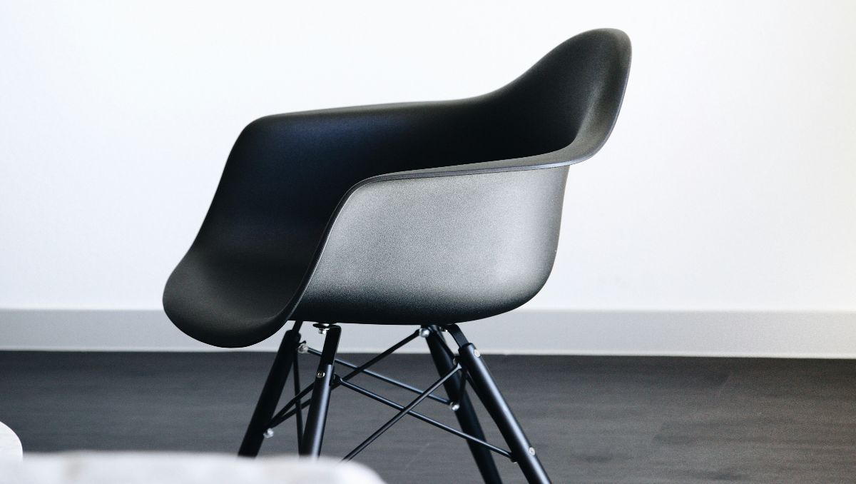 A black Eames style chair.