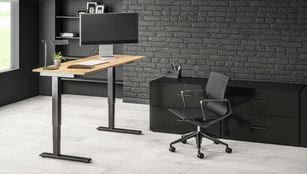 An electric standing desk and office chair