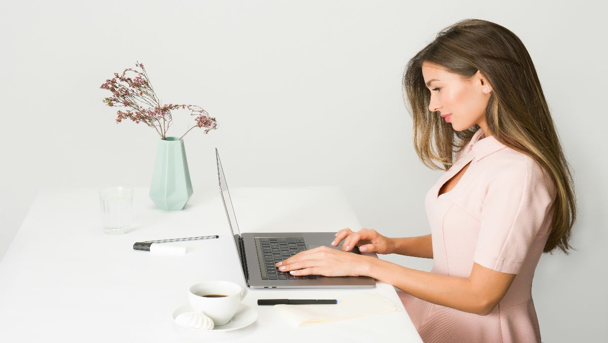 Woman working on her laptop with good posture