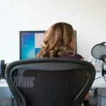 Focused woman sitting comfortably in one of the best ergonomic chairs for ADHD
