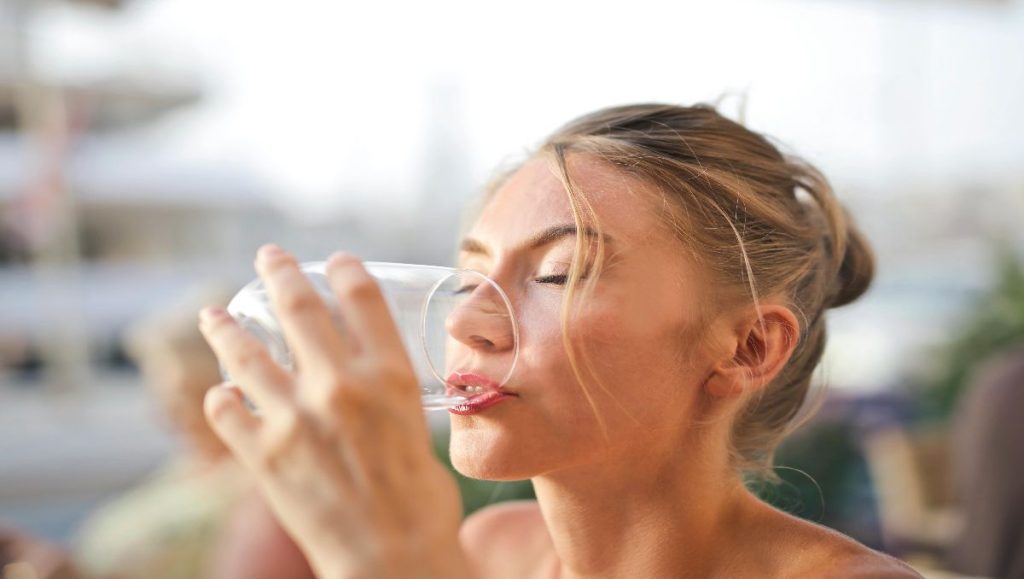 Woman Drinking water from Glass