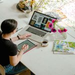 Woman working in desk with laptop