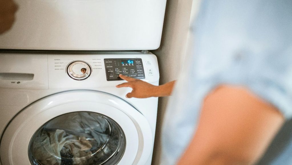 Man doing wash on the machine