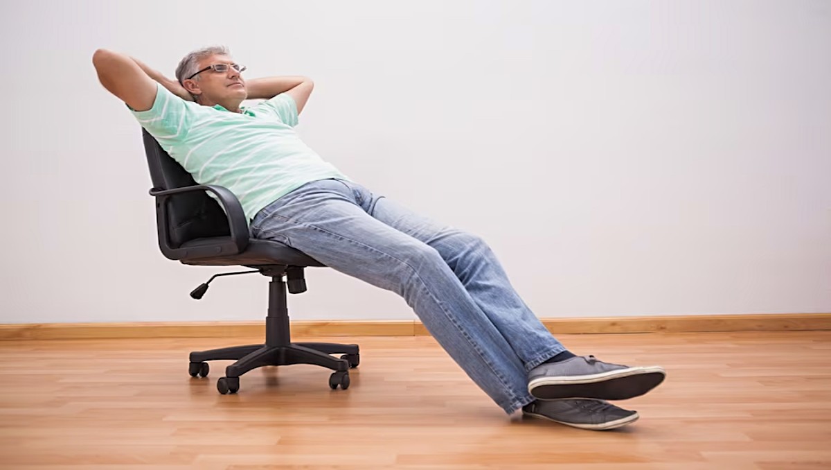 Man leaning backward his office chair