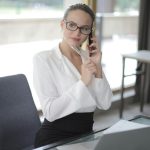 A woman business owner sitting on office chair