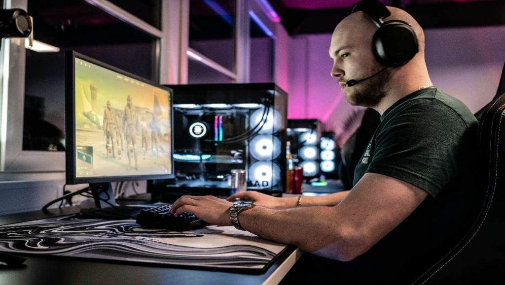 Gamer playing while sitting in computer high chair