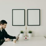 Remote worker sitting in ergonomic chair while working at home