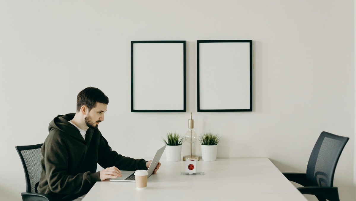 Remote worker sitting in ergonomic chair while working at home