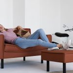 Woman taking a nap on ergonomic couch