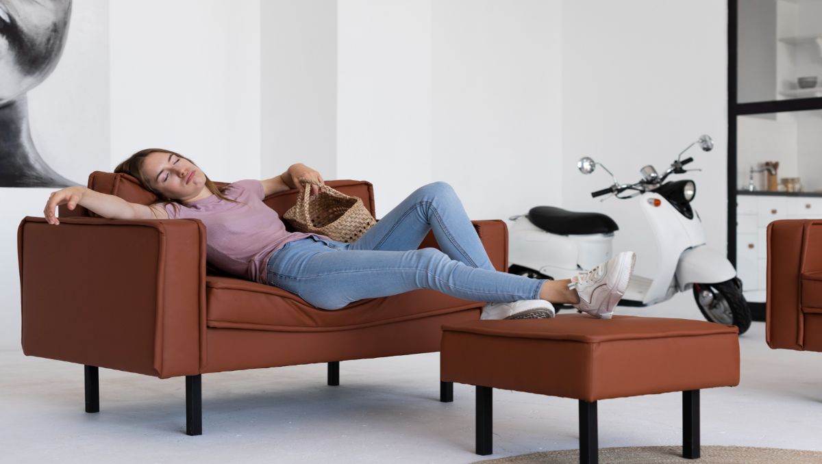 Woman taking a nap on ergonomic couch