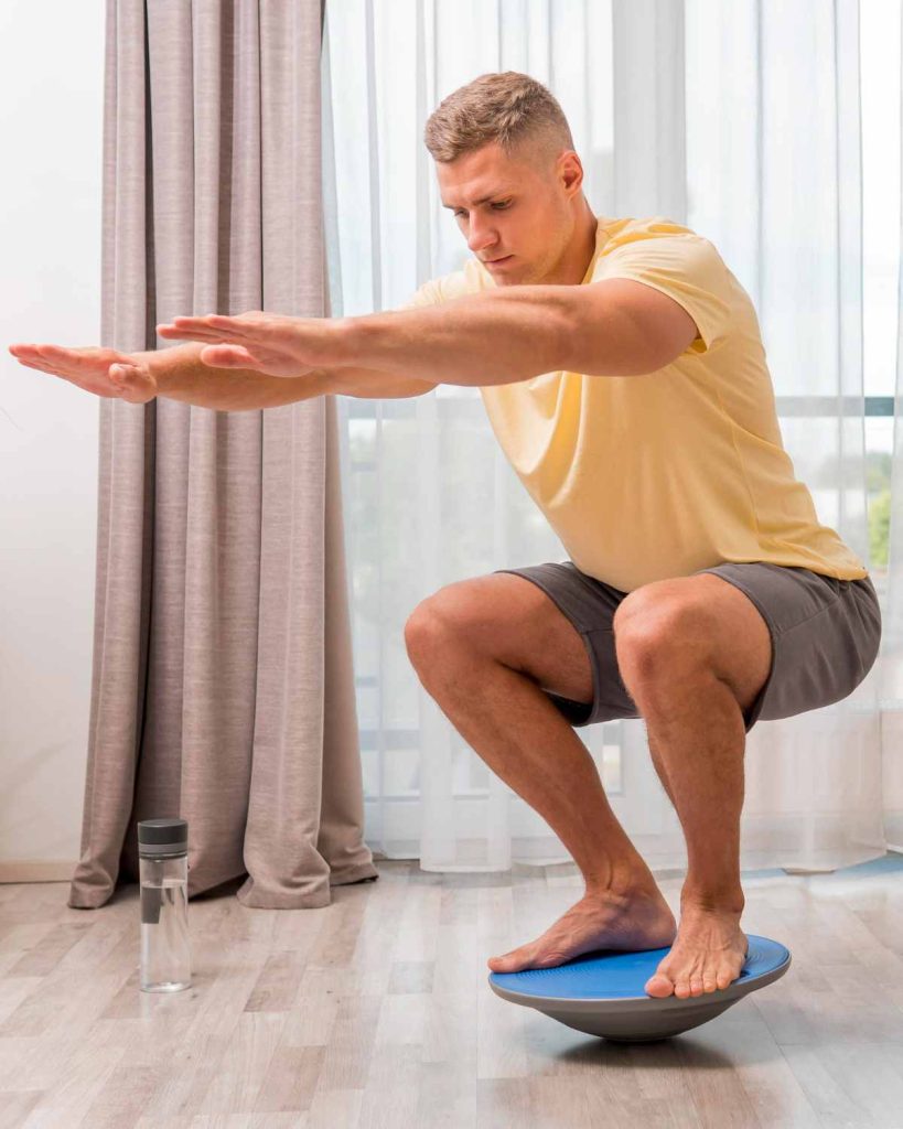 balance board exercises Squat on balance ball