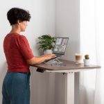 Woman working at a standing desk