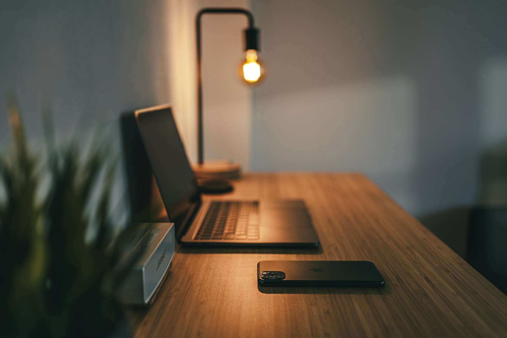 Dark wood desk with laptop on top