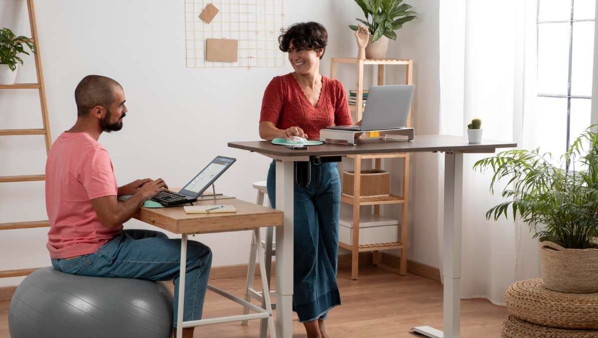 Man and woman employee working at office with flexible office furniture