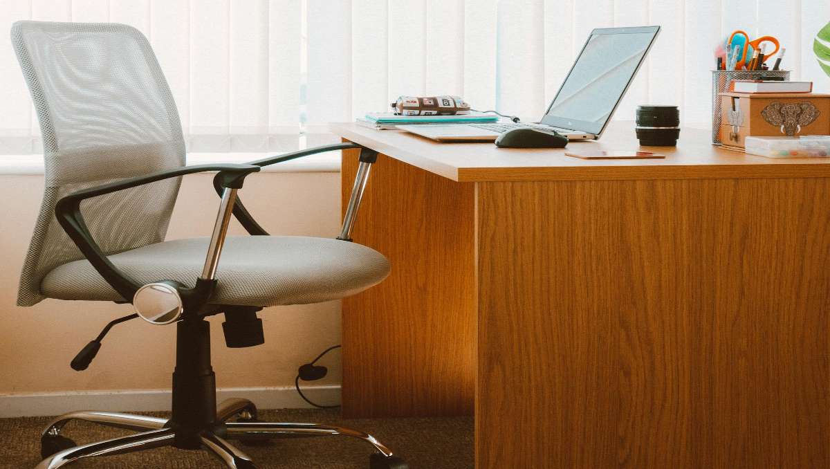 ergonomic desk made of hardwood and an office chair