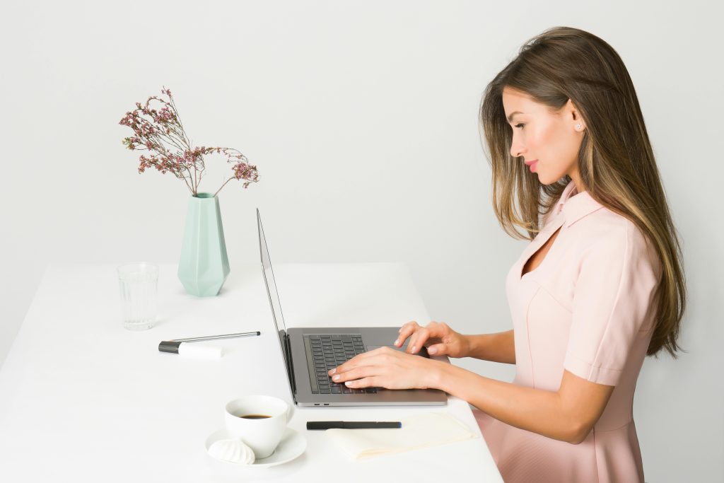 woman choosing sustainable standing desk for small apartment