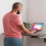 A man working from home using ergonomic amish desk