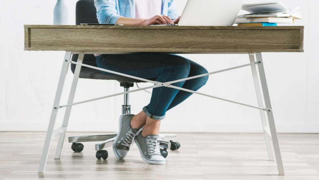 Girl working on top of amish ergonomic desk
