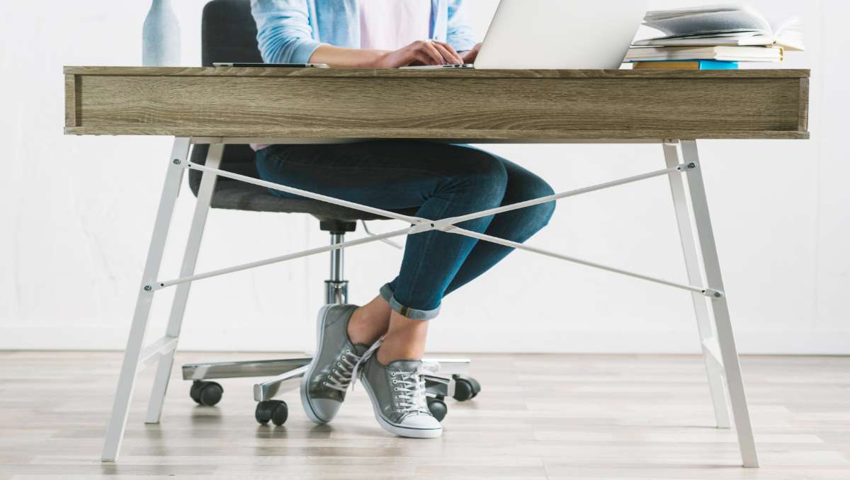 Girl working on top of amish ergonomic desk