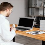 Man working on amish ergonomic desk