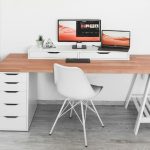 A bespoke wooden office table with white chair