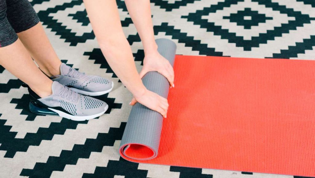 standing desk exercise equipment Girl rolling her foldable walking pad