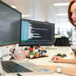 Girl working on a desk too high