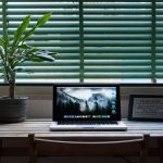 An oak custom wood top with plants and laptop on top