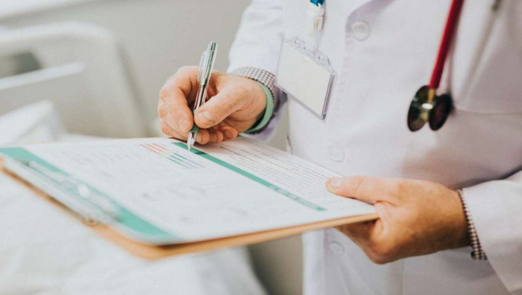 Doctor writing a note