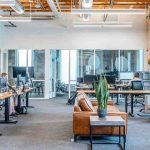 Office space with employees and desk setup