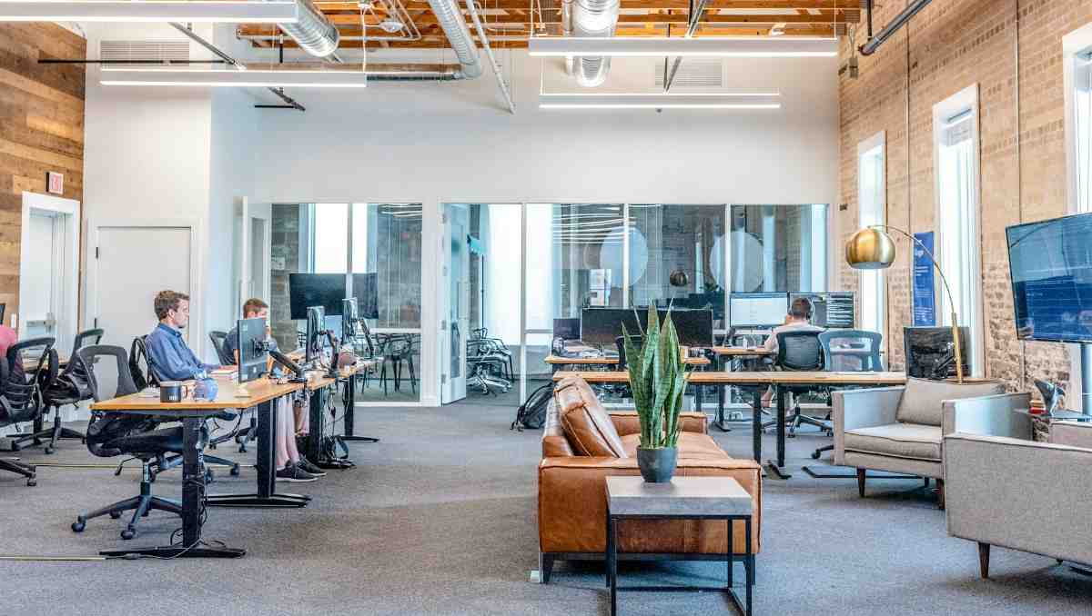 Office space with employees and desk setup