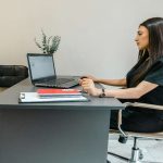 Girl working on a metal desk
