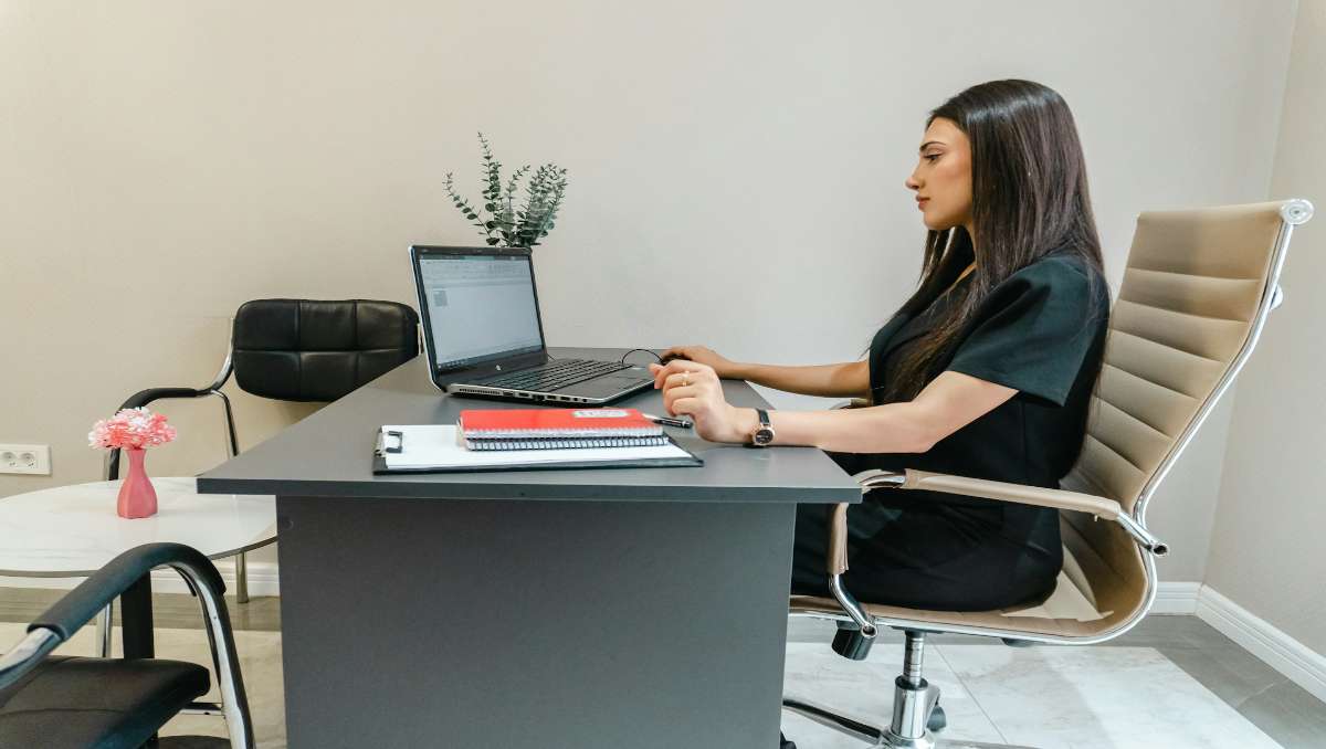 Girl working on a metal desk