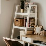 An organized desk with storage beside