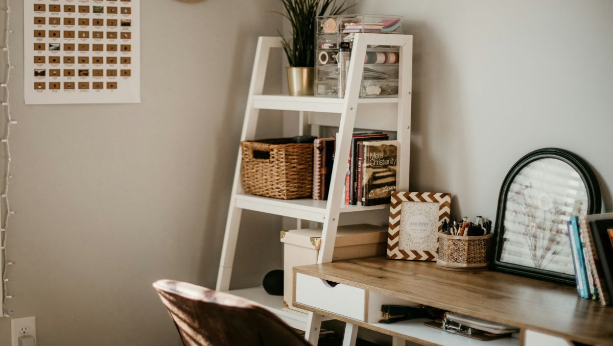 An organized desk with storage beside