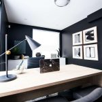Small office with black wall and minimal decor